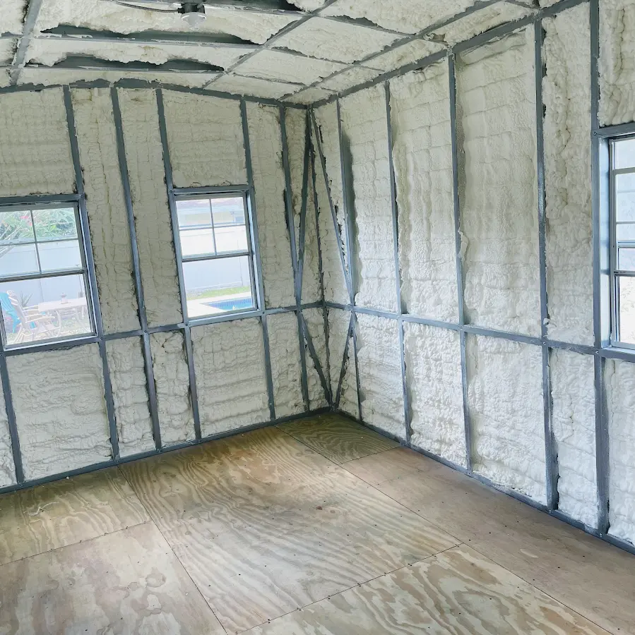 Closed-cell spray foam insulation applied to wall cavities in a residential project in Hampton